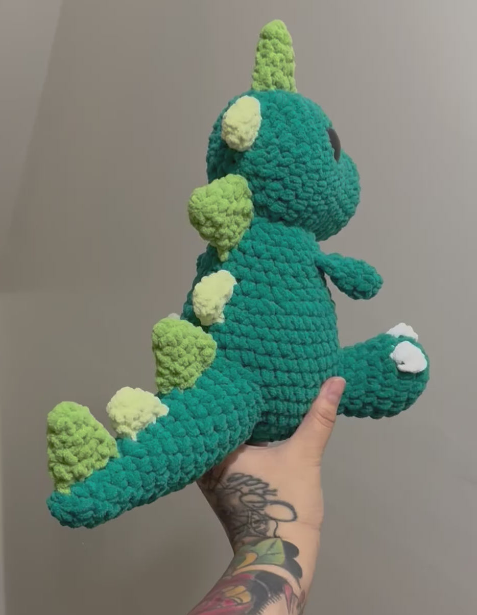Teal purple eyed dino